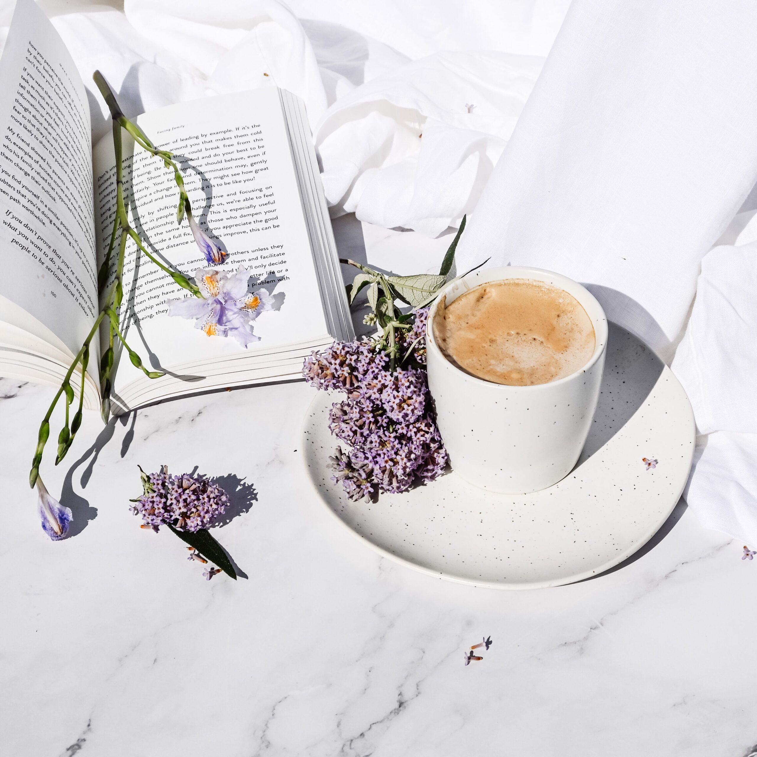 Lavender notebook, coffee and flowers